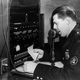 circa 1930: A member of the New York Metropolitan police using a radio-telephone link for communicating with the city’s police radio cars.